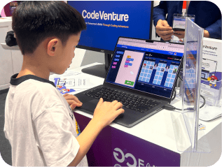 Young students collaborating on coding projects in classroom