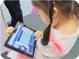Students showcasing their coding projects and games